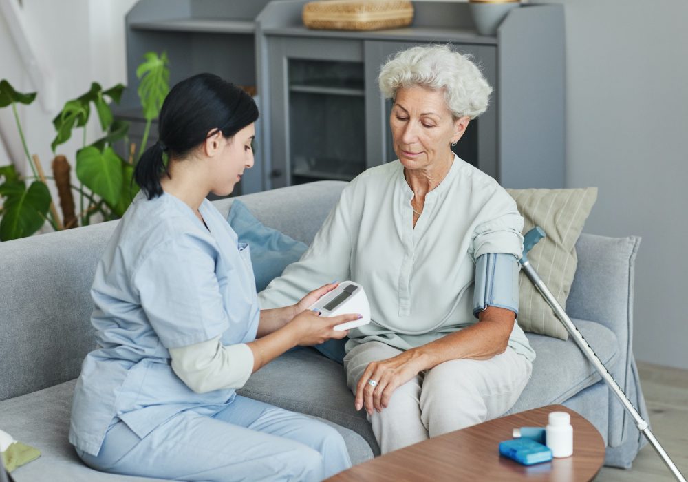 nurse-caring-for-senior-in-retirement-home.jpg